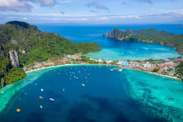 hi season boat and tourists on phiphi island Krabi Thailand aeri amazing Thailand hi season boats and tourists international on phi-phi island Krabi Thailand aerial view from drone camera